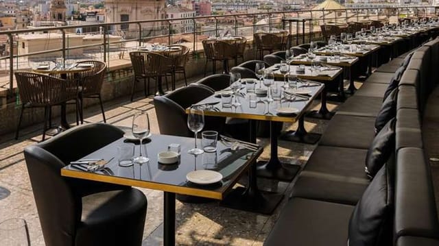 Rooftop restaurant in Milan Duomo set for corporate dinner reception and event networking.