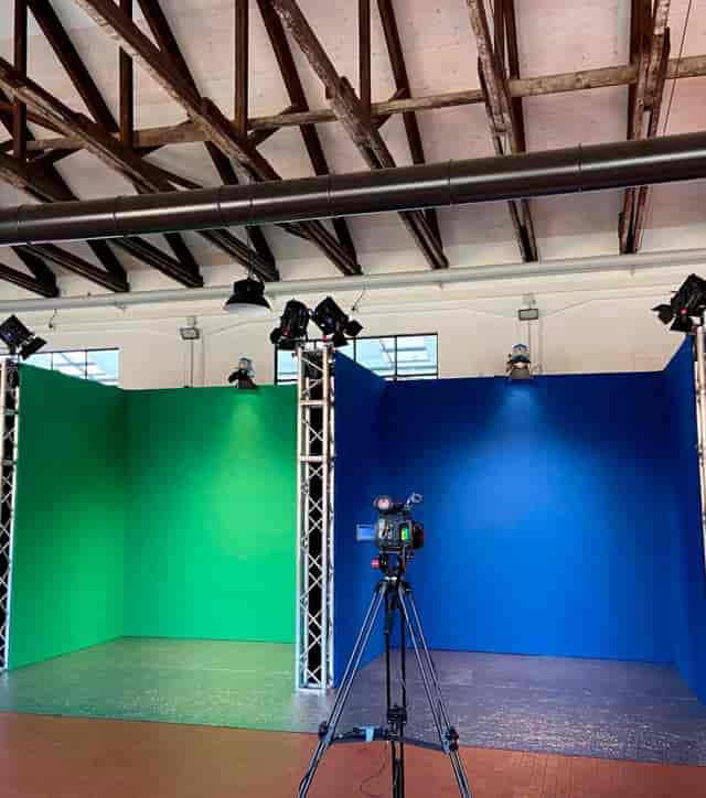 Team building in production studio with modular trussing for hybrid events and virtual broadcasts.