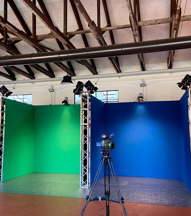 Team building in production studio with modular trussing for hybrid events and virtual broadcasts.