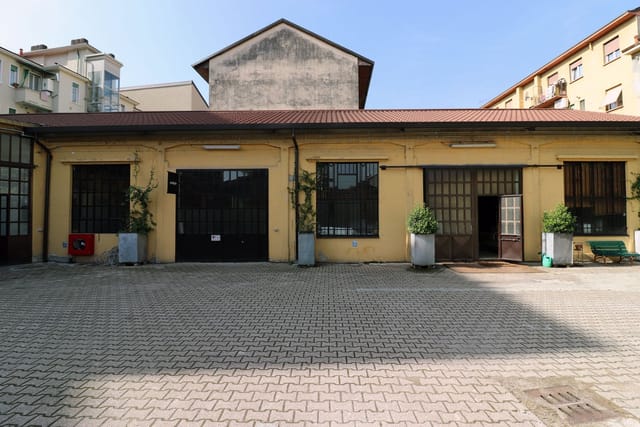Industrial-chic event space at Officine De Rolandi for creative workshops and brand activations.