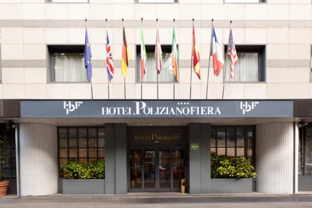 Hotel Poliziano CityLife: Four-star venue with prominent flags for corporate events and conferences.