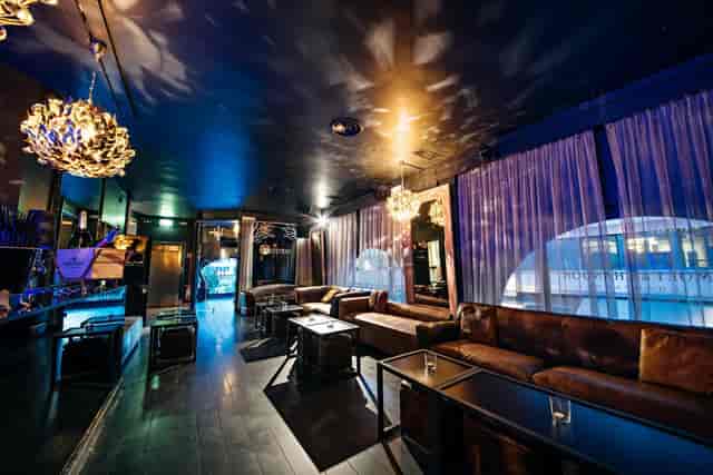 11Clubroom lounge with plush seating for VIP hospitality and executive networking events.