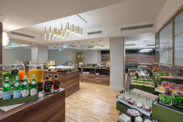 Upscale breakfast buffet in Porta Nuova meeting room for corporate conference catering.