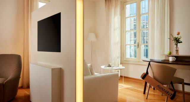 Avani Palazzo Moscova Milan hotel suite with workspace for bleisure and business travel.