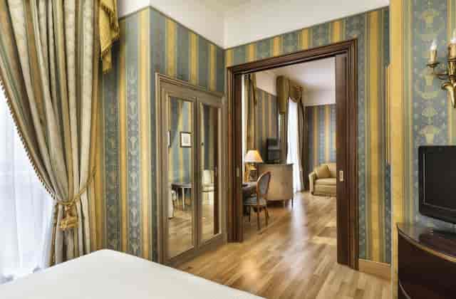 Luxury hotel suite with private workspace for executive travel and business meetings.