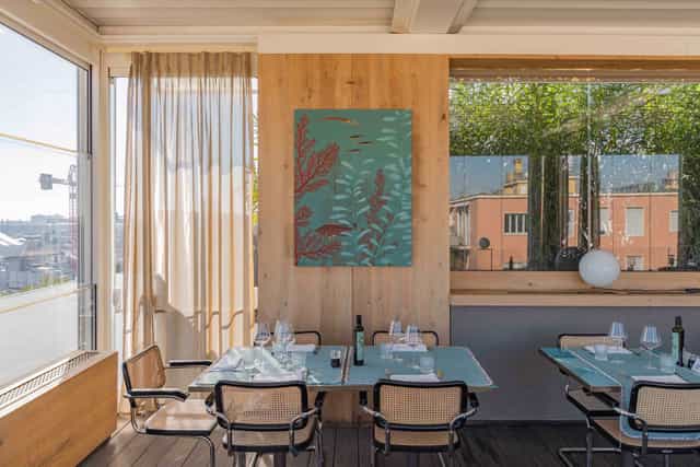 Upscale Terrazza12 rooftop lounge with natural light for corporate events and VIP board meetings.