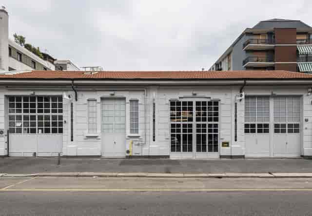 Industrial chic venue facade at Accademia Costume & Moda for pop-up events and gallery openings.