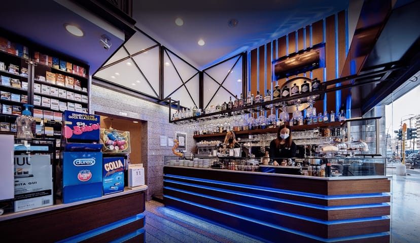 Bar in Veloce Milano illuminated counter for airport transit lounge catering and event service.