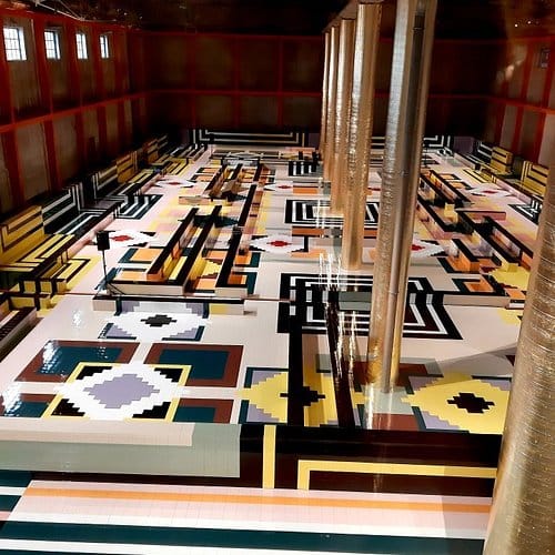 Modern geometric gallery event space for high-concept runway shows and immersive presentations.