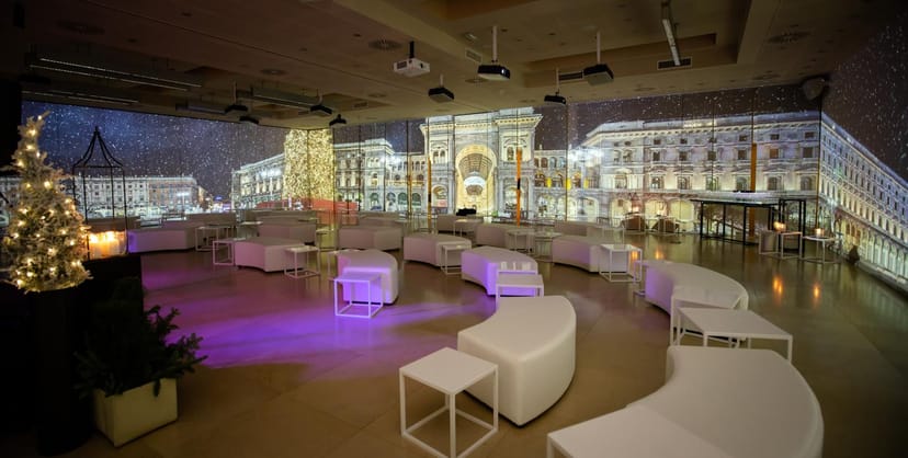 Immersive projection room with lounge seating for corporate events and evening receptions.