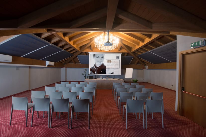 Theater-style breakout room with exposed beams at Restaurant Sempione 320 for corporate events.
