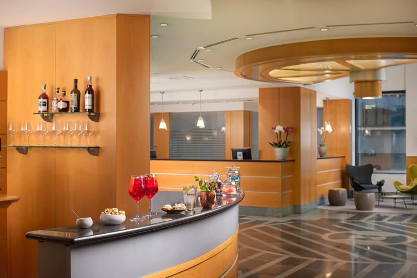 Modern hotel lobby bar at NH Milano Corso Buenos Aires for VIP receptions and networking events.