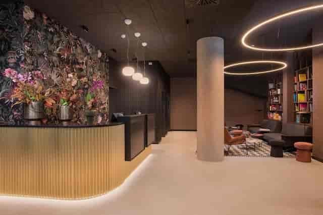 Modern boutique hotel lobby, ideal for stylish corporate event registration or intimate meetings.