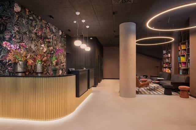 Modern boutique hotel lobby, ideal for stylish corporate event registration or intimate meetings.