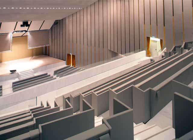 Modern tiered auditorium in Aula Magna for professional keynotes and academic lectures.