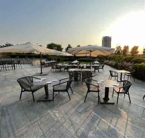 Outdoor ballroom terrace set for a cocktail reception, ideal for corporate networking events.