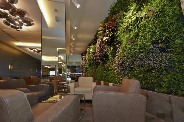 Ristorante Visconteo lounge with vibrant living wall for corporate networking and events.