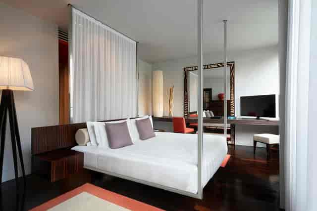 Le Noir guest room with executive workspace for VIP speakers and corporate event hosting.