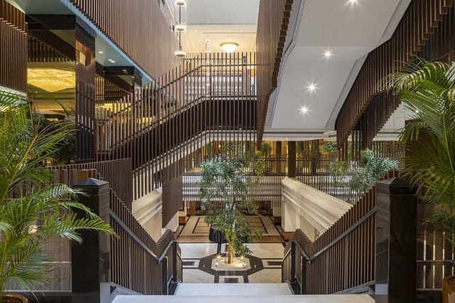 Luxury Melia hotel foyer for corporate event registration and professional networking.