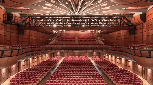 BiM Milano auditorium with tiered seating for professional keynote sessions and award ceremonies.