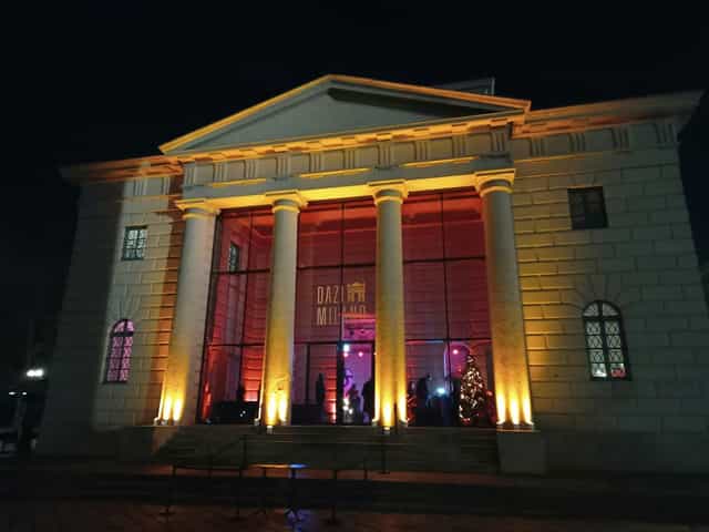 High-end Milan cocktail bar, neoclassical architecture, evening event venue.