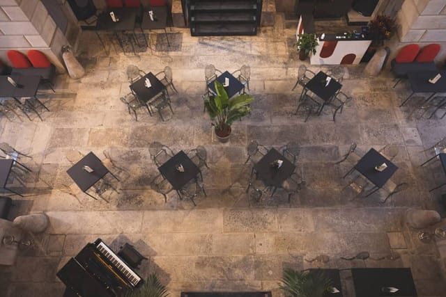 Sophisticated cabaret-style restaurant with piano for networking events and cocktail service.