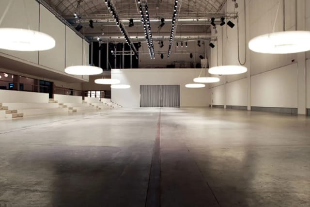 Industrial-chic Foyer in La Pelota venue with tiered seating for fashion shows and product launches.