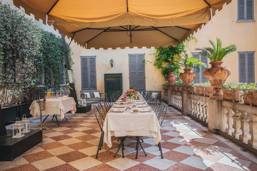 Al fresco dining terrace at Newton House with banquet table for intimate outdoor events.