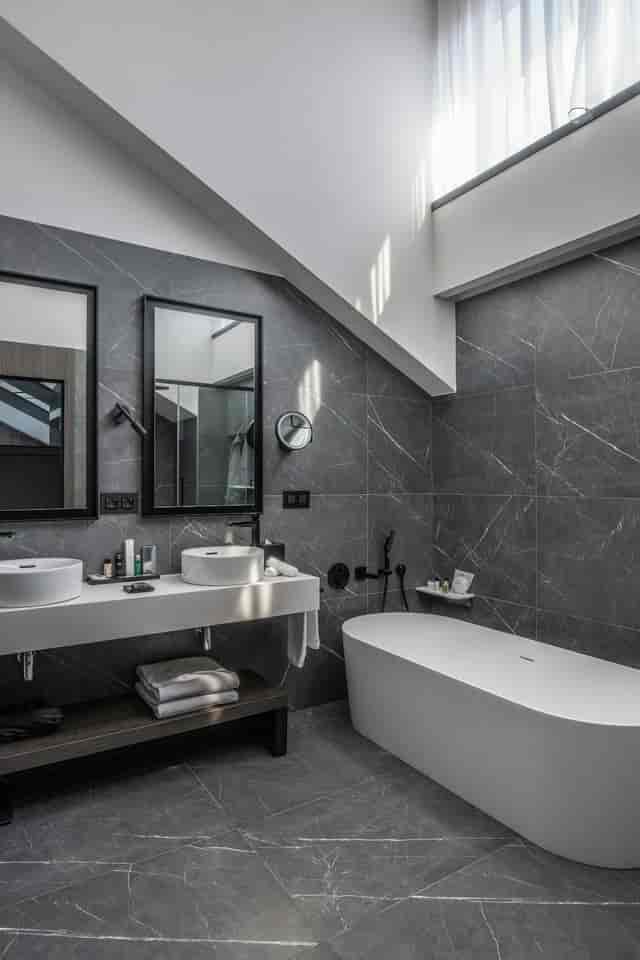 Luxury hotel bathroom in Veloce Milano, Radisson Collection. Executive retreat, event venue.