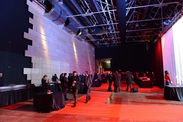 Spazio Litometalli red carpet event venue with banquet tables for corporate networking receptions.