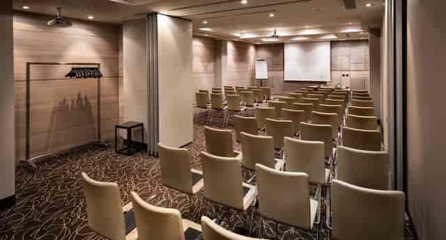 Theater-style meeting room with AV setup for corporate training and presentations.