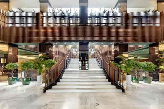 Milan Marriott event space with grand staircase for VIP arrivals and corporate delegate registration.