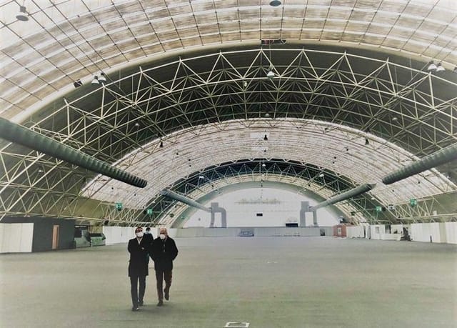 Industrial event space, Padiglione D, high-ceiling venue, trade show, conference hall.