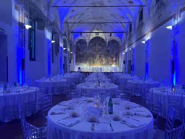 Gala setup in Salone degli Affreschi featuring blue uplighting and elegant event seating.