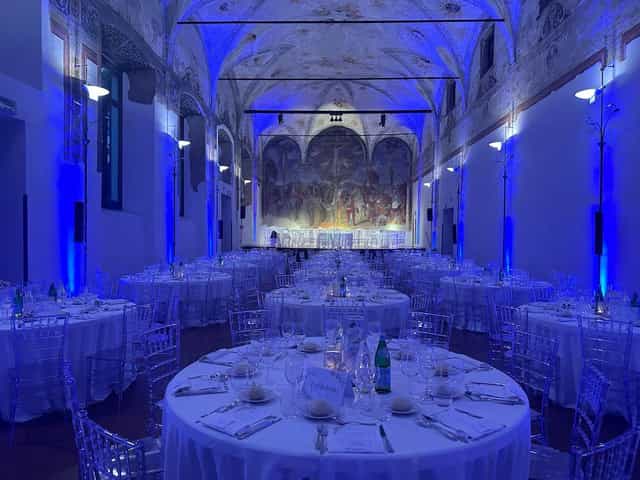 Gala setup in Salone degli Affreschi featuring blue uplighting and elegant event seating.