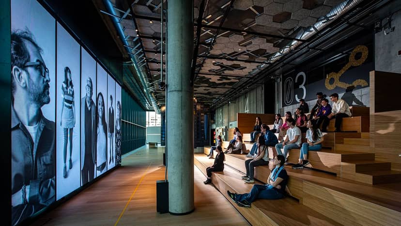 STEP Café event space with large digital screen for corporate workshops and intimate presentations.