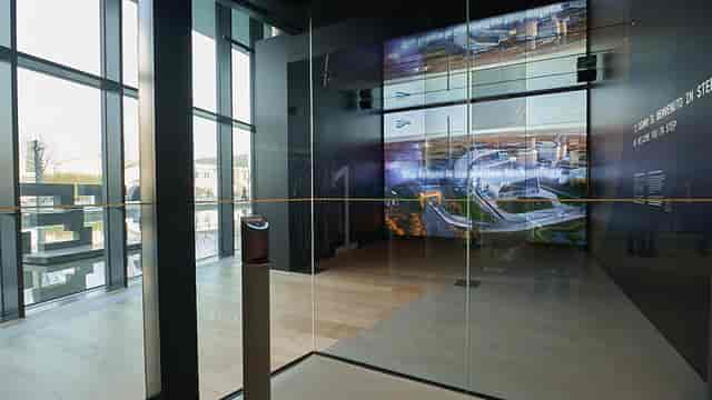 Modern STEP FuturAbility District foyer with digital screens for corporate events and exhibitions.