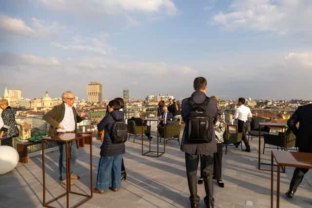 Hotel Ariston rooftop terrace networking reception with high-top tables for corporate events.
