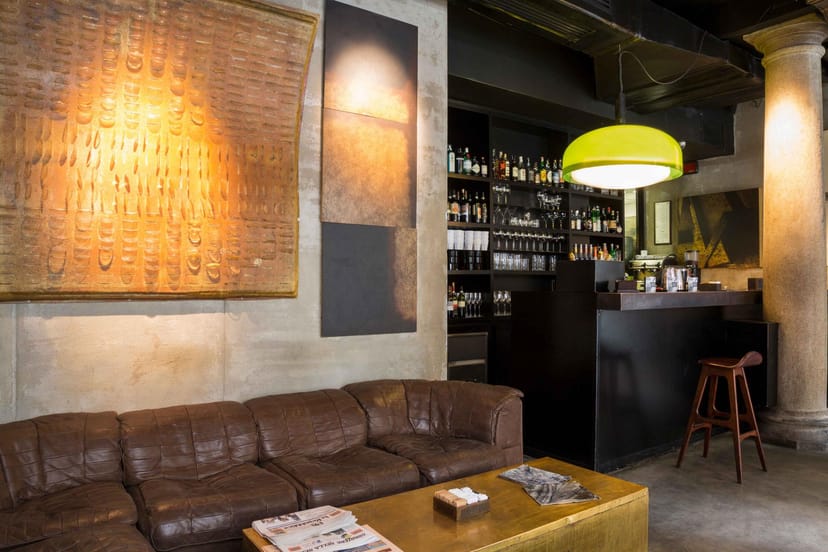 Rustic-industrial STRAF Bar: intimate networking and conference breakout space.