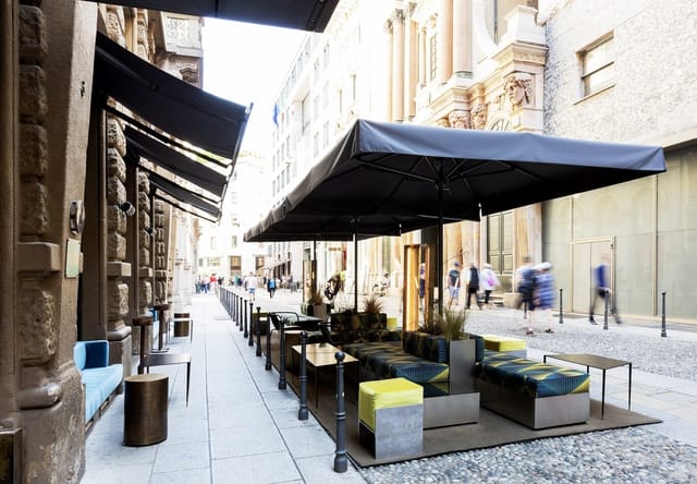 STRAF Bar outdoor lounge with sleek umbrellas for intimate networking and corporate event spaces.