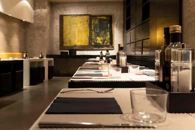 Minimalist STRAF Restaurant private dining room for executive board dinners and client events.