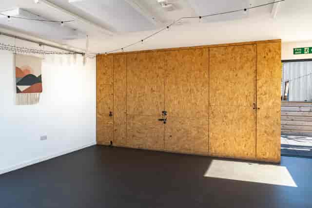 The Studio at Sea Lanes Brighton: OSB feature wall for pop-up workshops and creative events.