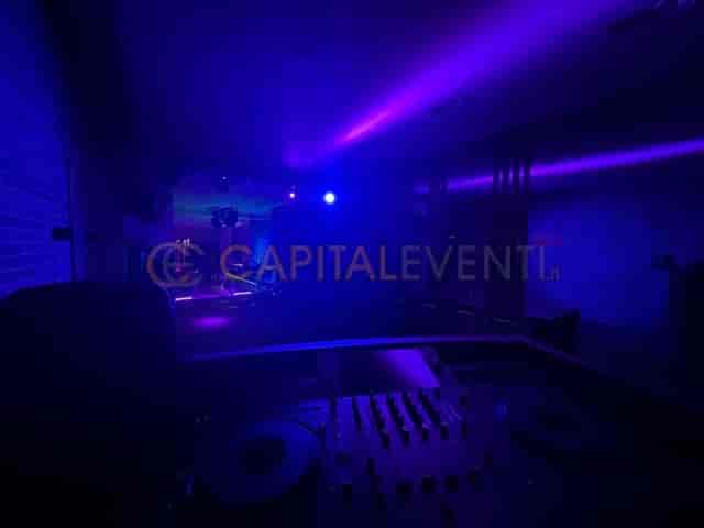 Cocktail bar at Studio 26 with blue DJ lighting for dance floor events and after-party lounge vibe.