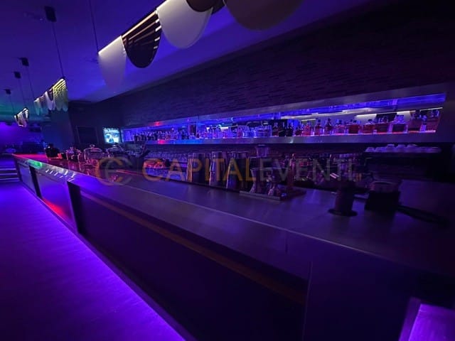 Sleek Studio 26 bar with LED lighting for VIP receptions and corporate networking events.