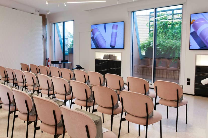 Minimalist theater-style seating at Spazio IlluMi Terrace for premium product launch event.