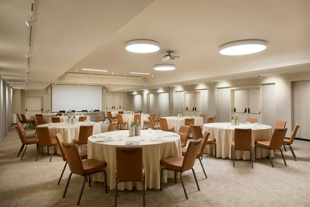 Banquet-style meeting room at Starhotels Ritz for corporate workshops and breakout sessions.
