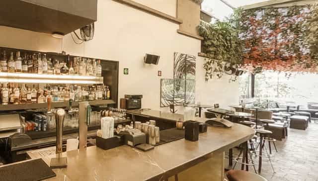 Blanco Castelar venue with bar for networking mixer or post-conference reception.