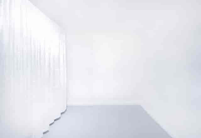Purist Gallery white event space with elegant drapery for corporate events and wedding venue hire.
