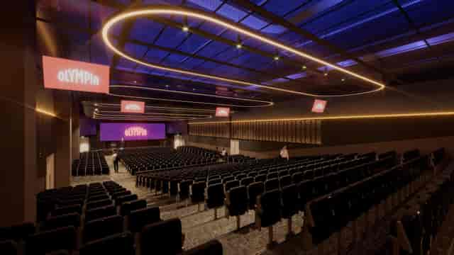 Modern tiered auditorium at Olympia ICC for corporate keynotes and professional presentations.