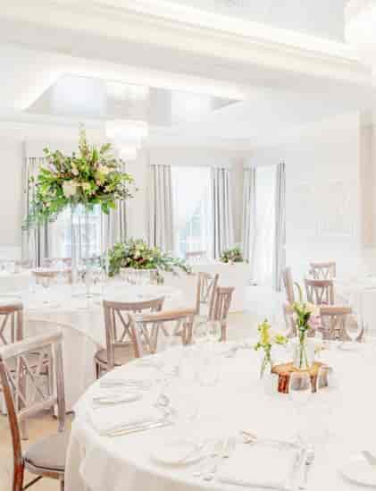 Elegant event space for Christmas parties in Old Palace Chester with floral decor.
